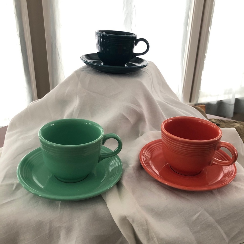 Three Fiesta tea cups and saucers